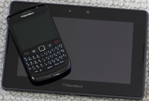 "Tai Po, Hong Kong, China - June 17, 2011: A BlackBerry Bold (9780) smartphone on top of a BlackBerry Playbook tablet. The Playbook is the first ever BlackBerry tablet. These are two relatively recent BlackBerry devices."